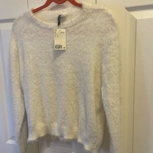 Ladies white sweater with long sleeves